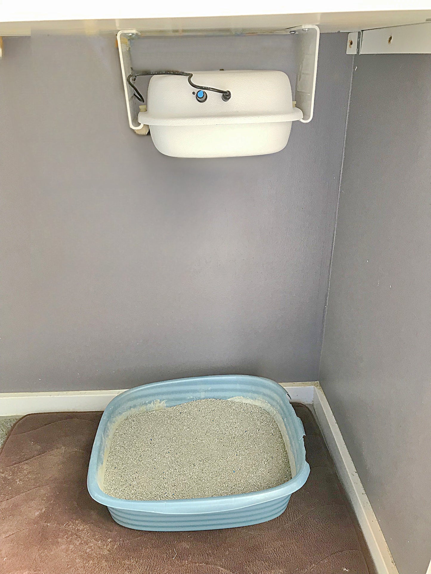Purrified Air purifier mounted under counter
